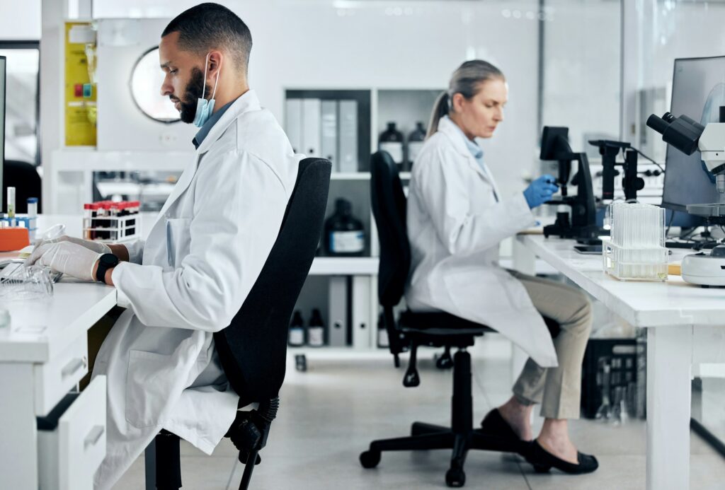 Science, covid innovation and scientist people working in research biotechnology laboratory. Divers